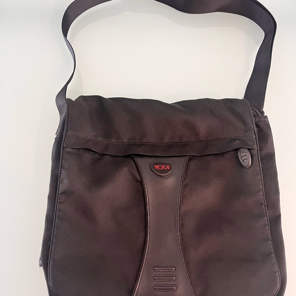 Tumi Black Messenger Bag with Red Logo Accent